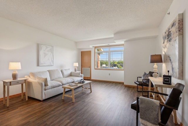 living room featuring a textured ceiling and dark hardwood / wood-style flooring