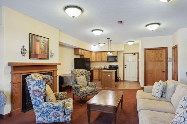 carpeted living room featuring a textured ceiling