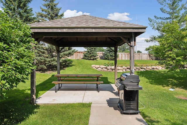 view of home's community with a gazebo, a patio, and a lawn