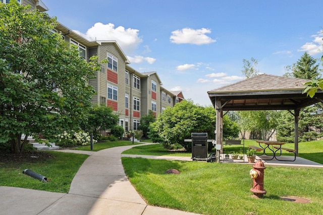 view of home's community with a gazebo and a lawn