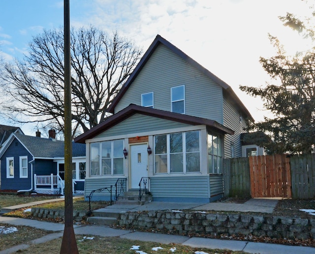 view of front of home with a sunroom