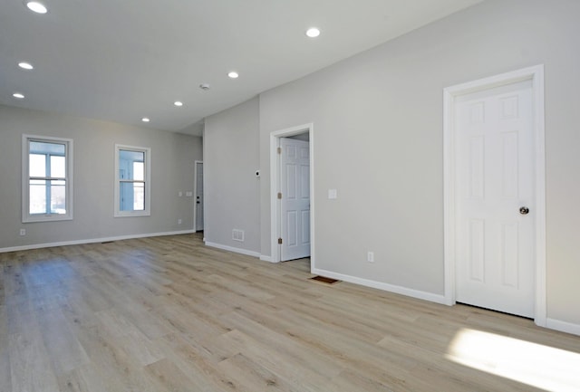 unfurnished room with light hardwood / wood-style flooring