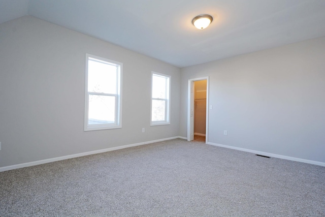 spare room featuring carpet flooring