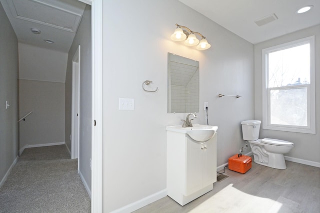 bathroom featuring toilet and vanity