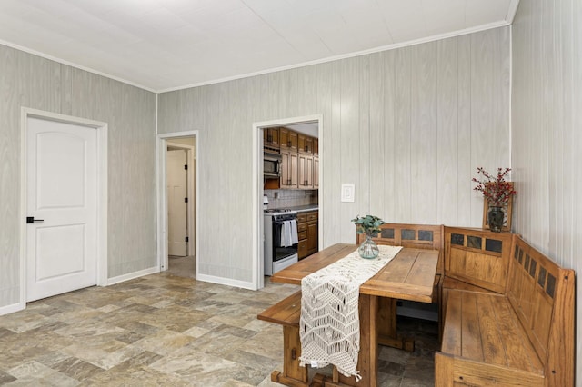 dining area featuring crown molding