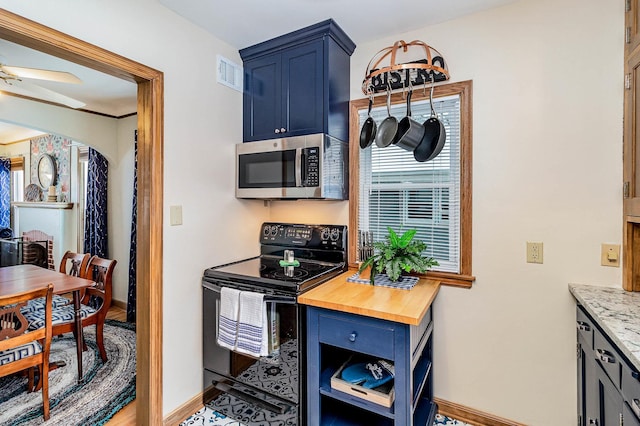 kitchen featuring light stone countertops, ceiling fan, blue cabinetry, and black / electric stove