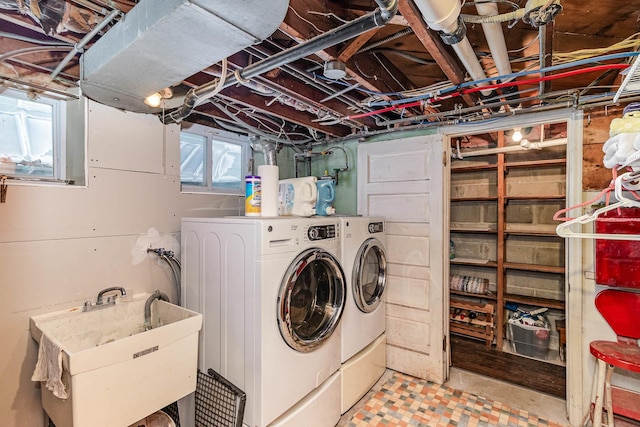 laundry room with washing machine and dryer and sink