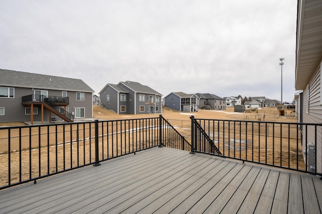 wooden terrace featuring a residential view