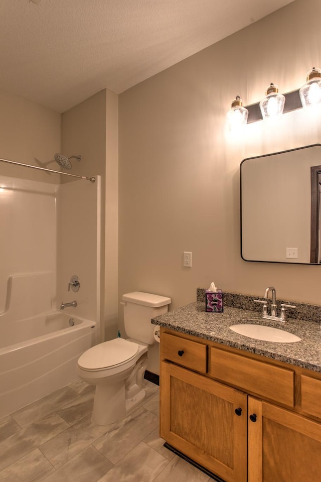 full bathroom with a textured ceiling, tile patterned flooring, toilet,  shower combination, and vanity