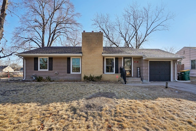 ranch-style home featuring a garage and a front yard