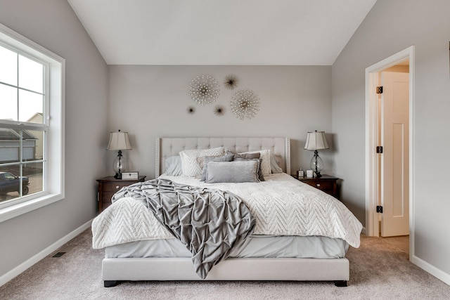 carpeted bedroom featuring vaulted ceiling