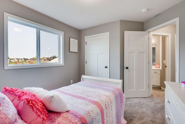 bedroom with light colored carpet