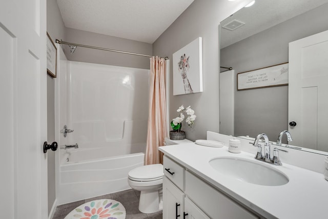 full bathroom with toilet, a textured ceiling, tile patterned flooring, shower / bath combo with shower curtain, and vanity