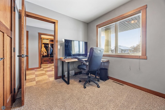 home office with light carpet