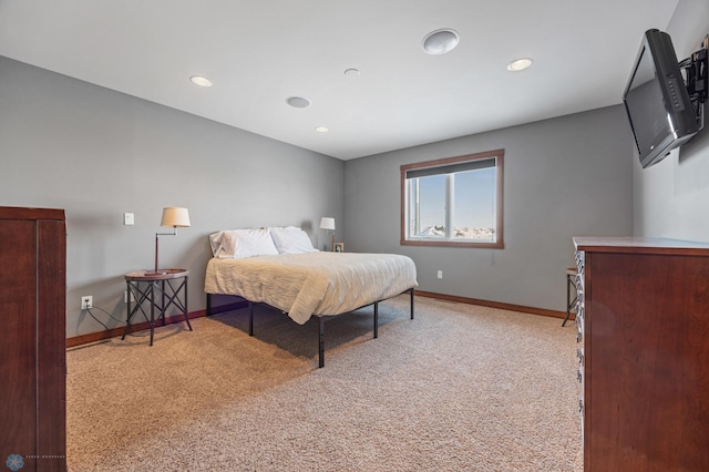 bedroom featuring light colored carpet