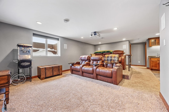 carpeted cinema featuring bar area