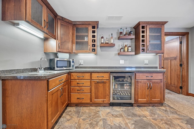 kitchen featuring sink and wine cooler