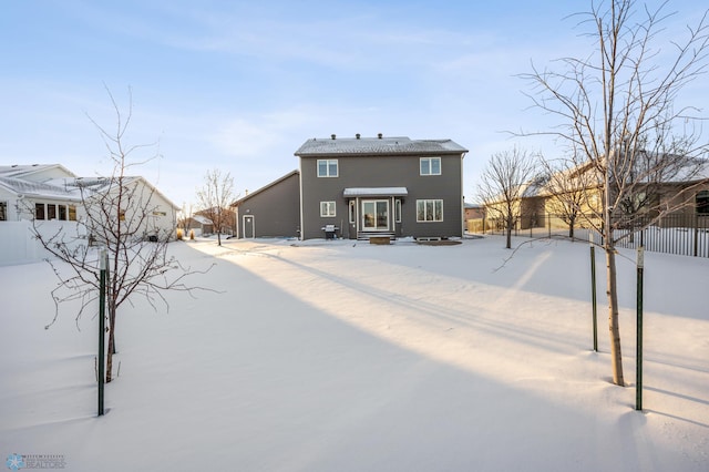 view of snow covered house