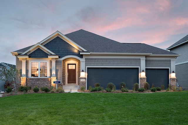 craftsman-style home with a garage and a lawn