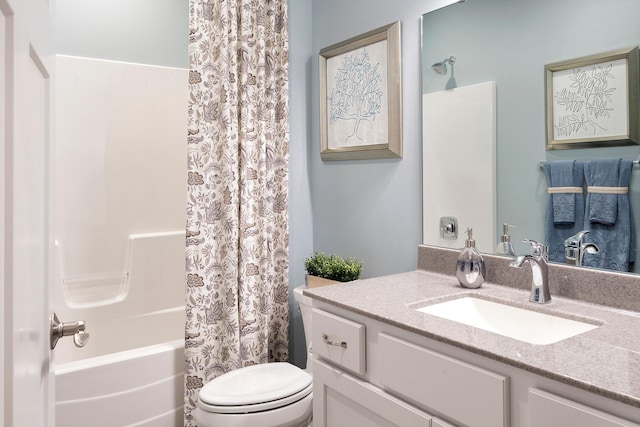 full bathroom featuring toilet, vanity, and shower / tub combo