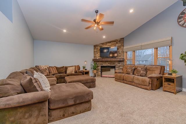 carpeted living room with ceiling fan, high vaulted ceiling, and a fireplace