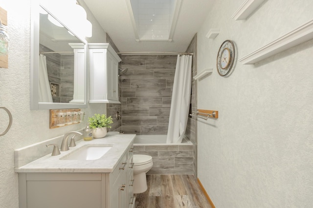 full bathroom with shower / tub combo, hardwood / wood-style floors, vanity, and toilet