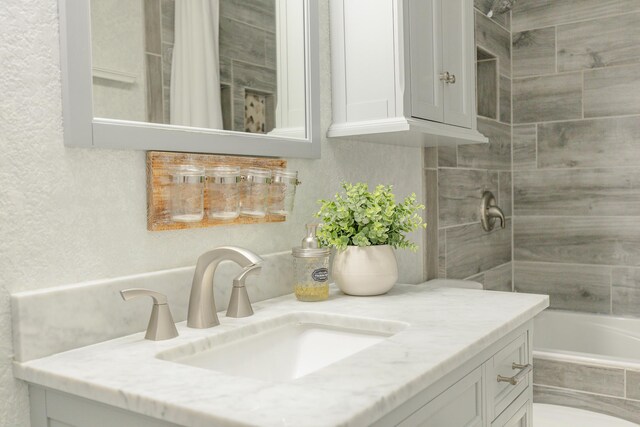 bathroom with vanity and shower / bath combination with curtain