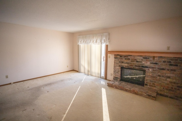 unfurnished living room with a fireplace and carpet flooring