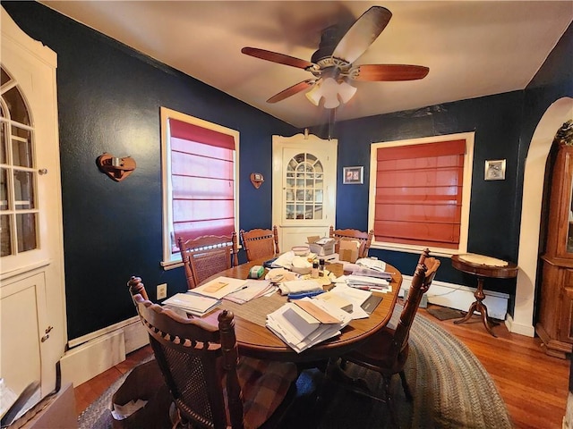 dining space featuring ceiling fan and hardwood / wood-style flooring