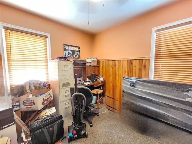 home office featuring wooden walls