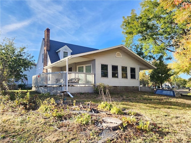 view of side of property featuring a chimney