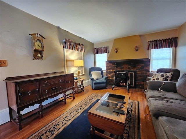 living room featuring baseboards and wood finished floors