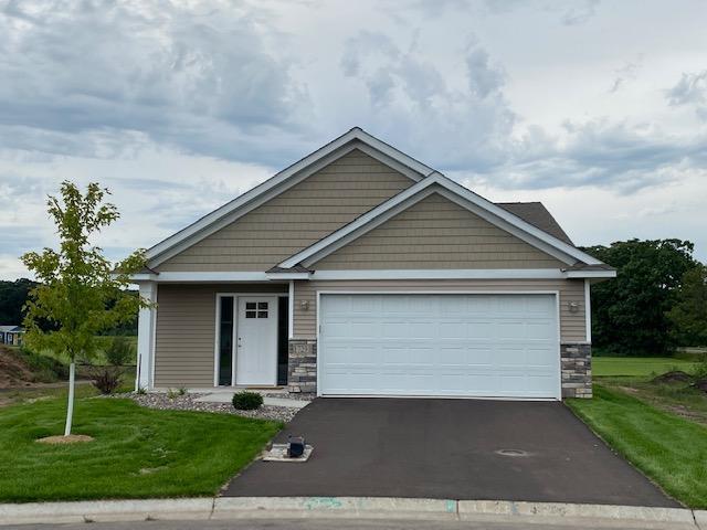 craftsman house featuring a garage and a front lawn