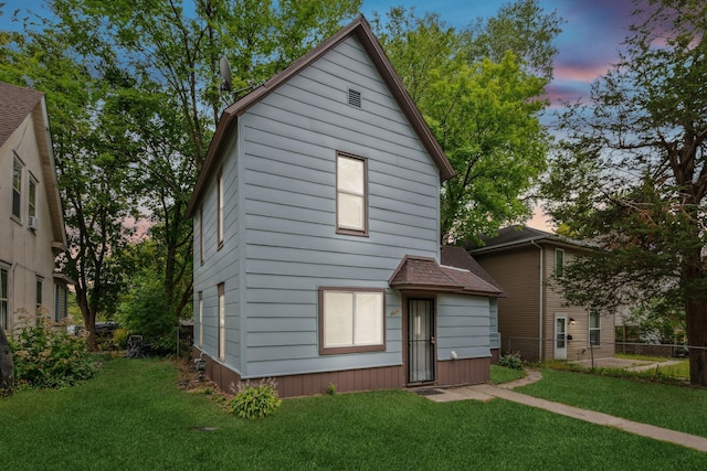 view of front of property with a yard