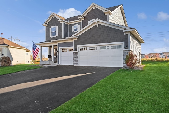 view of front of property featuring a front lawn and a garage