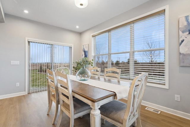 dining room with hardwood / wood-style flooring