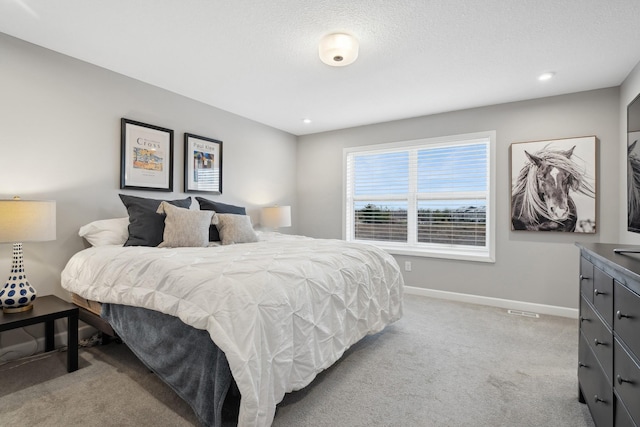 bedroom featuring light colored carpet