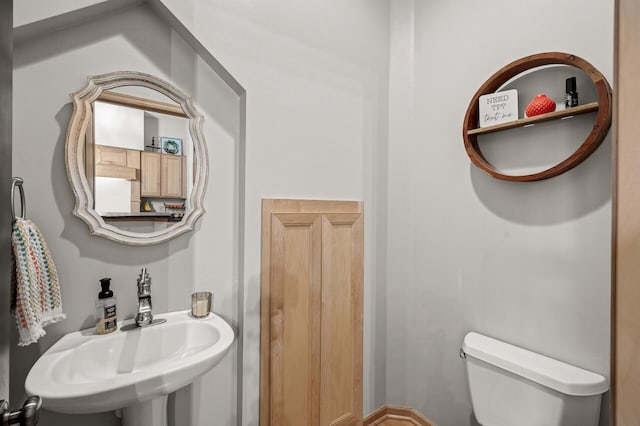 bathroom with sink and toilet