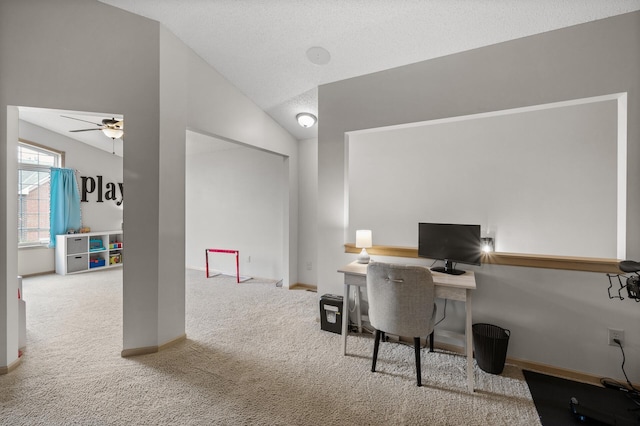 home office with ceiling fan, lofted ceiling, carpet, and a textured ceiling