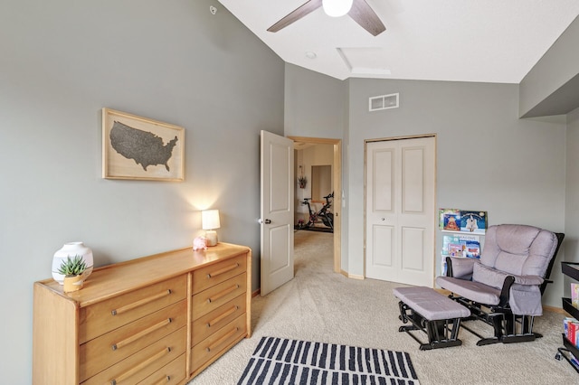 living area with high vaulted ceiling, light carpet, and ceiling fan