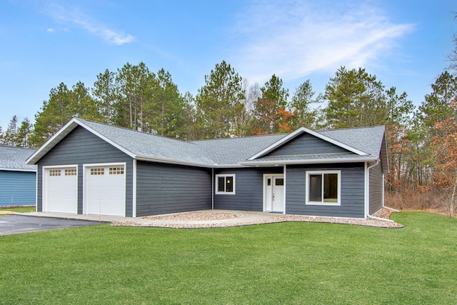 ranch-style home with a garage and a front yard