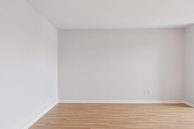 spare room featuring light hardwood / wood-style floors