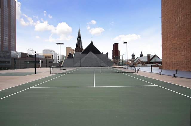 view of sport court with basketball hoop