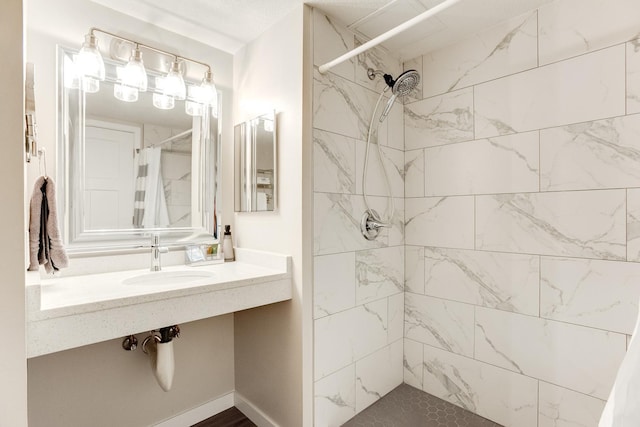 bathroom with sink and curtained shower