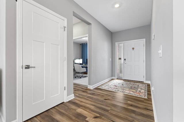 entrance foyer with dark hardwood / wood-style floors