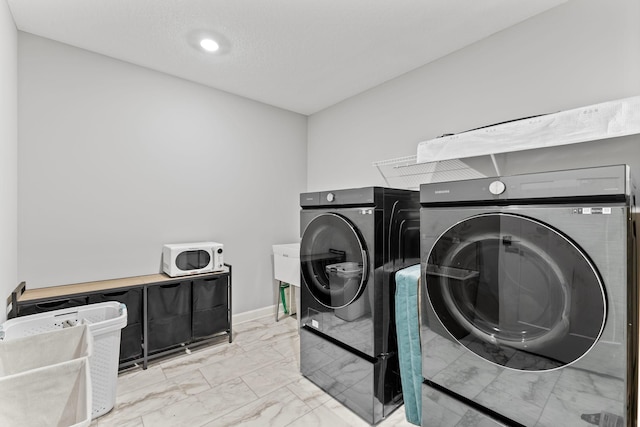 laundry room with separate washer and dryer