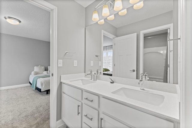 bathroom with a textured ceiling and vanity