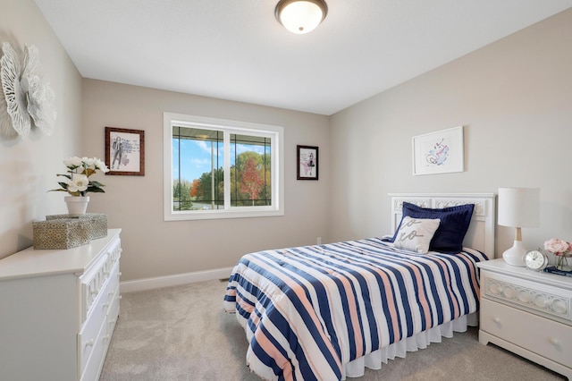 bedroom with light colored carpet