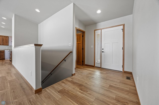 foyer entrance featuring light hardwood / wood-style flooring