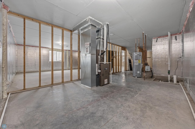 basement with heating unit and electric water heater